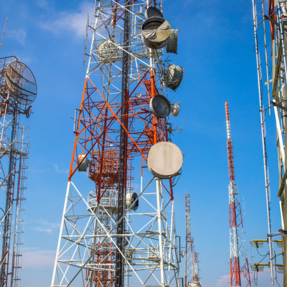cellular communication towers on blue sky